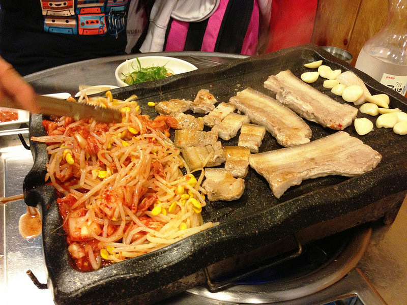 Tasting the black pork BBQ in Jeju Island